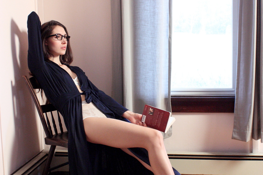 Matchplay designer loungewear in navy - shown girl reading book in navy robe & ivory lingerie indoors