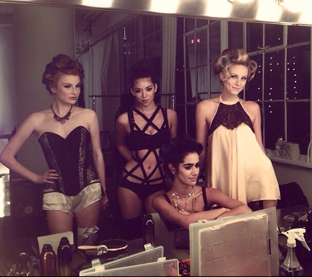 models backstage in rollers getting boudoir ready