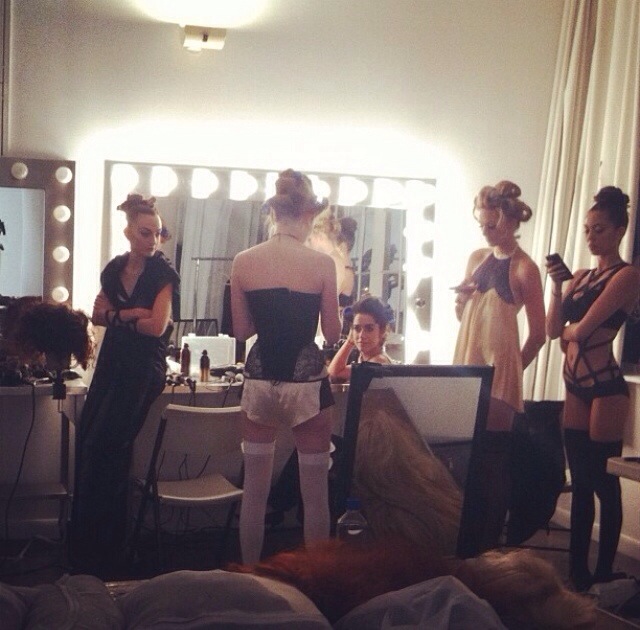 models backstage at oribe hair event styled in innerwear as outerwear