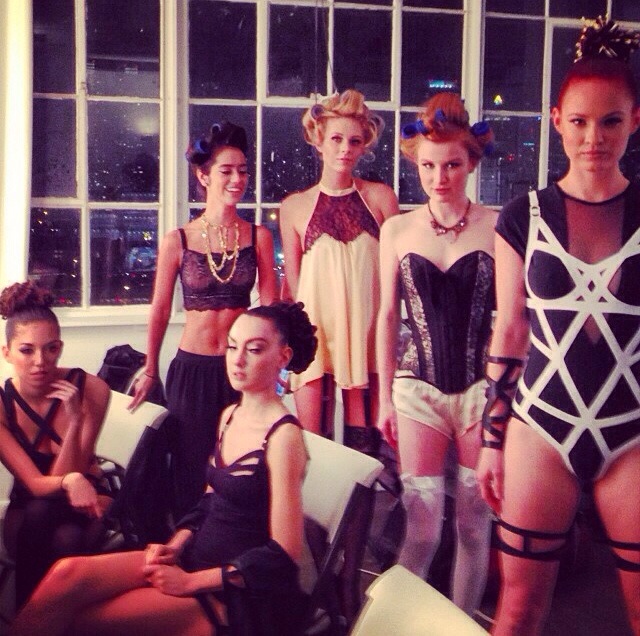 models backstage at oribe hair event styled in innerwear as outerwear