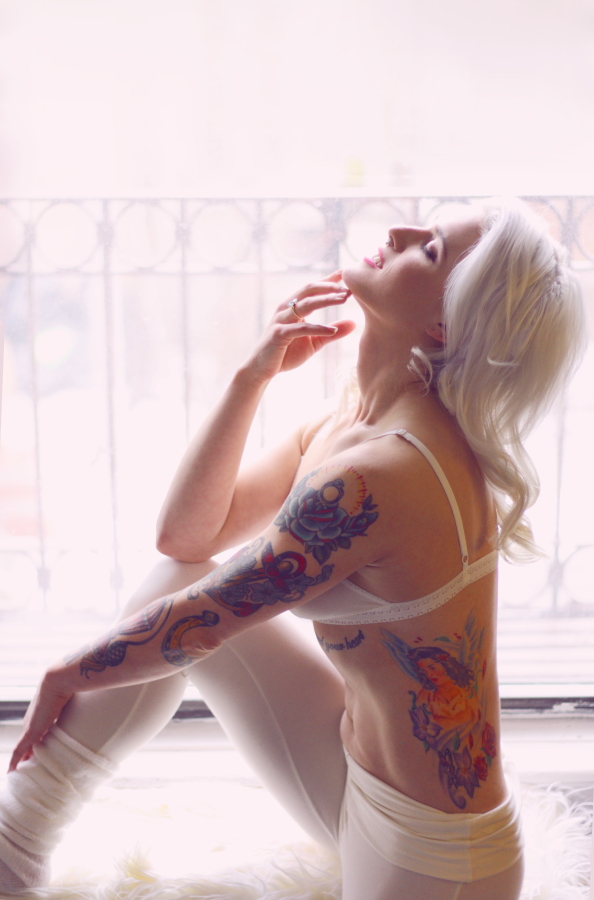 casey leigh aka the blonde bombshell with tattoos in window on BTS blog