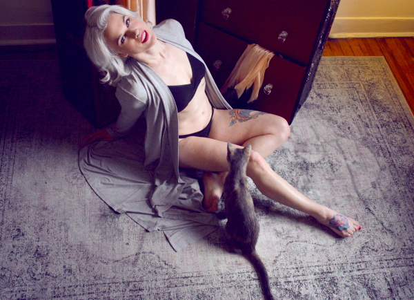 casey in lingerie/robe with kitten x steamer trunk on BTS blog