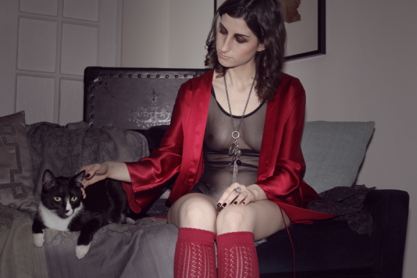 tuxedo cat & model in mesh bodysuit & red silk robe on BTSlingerie Blog