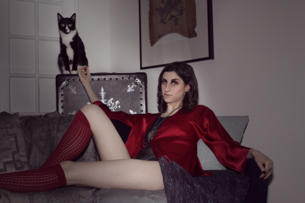 tuxedo cat & model in mesh bodysuit & red silk robe on BTSlingerie Blog