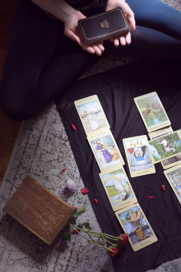 hands hoding tarot cards, red roses, crystal, ombre tights - BTSlingerie Blog