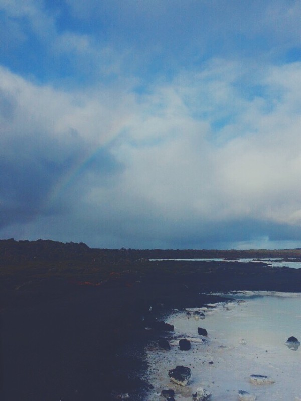 rainbow over blue lagoon in iceland